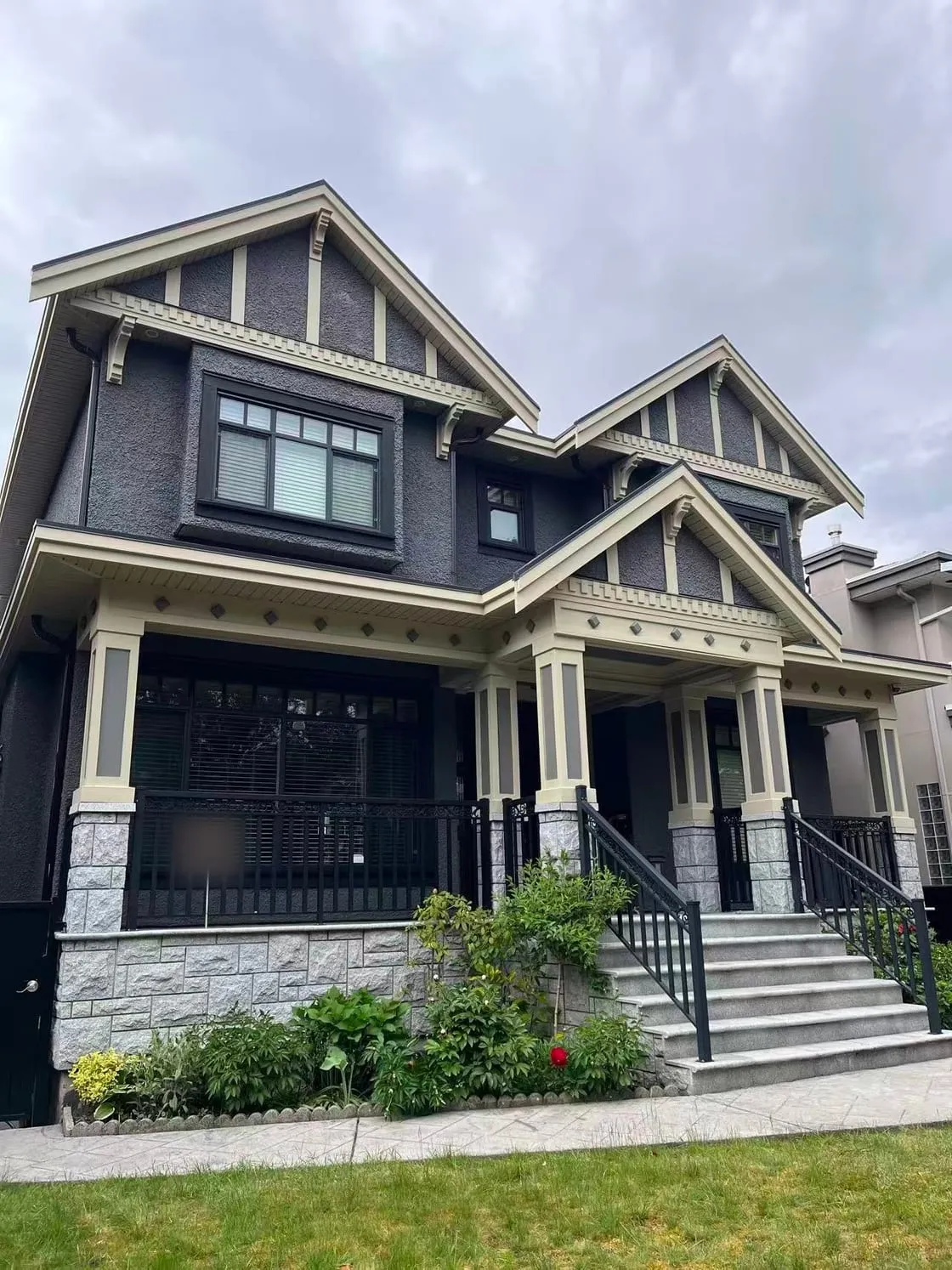 Dark exterior walls and pale trim