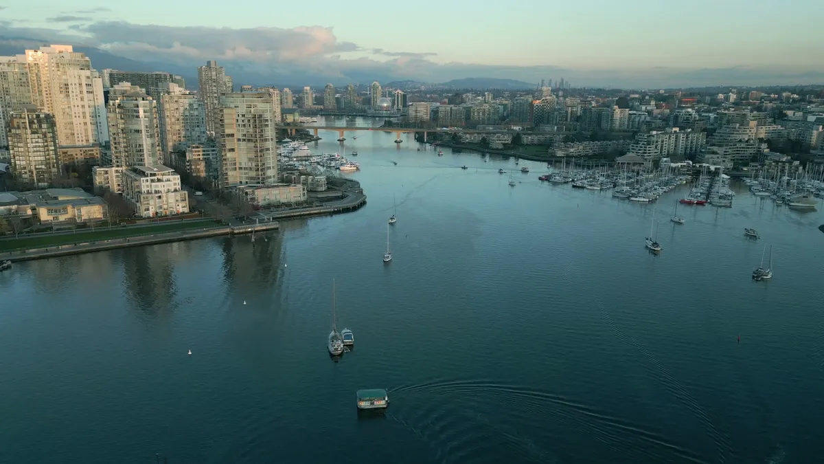 Aerial view of downtown Vancouver towers and False Creek at sunset